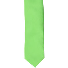 Load image into Gallery viewer, The front of a spring green tie, laid flat