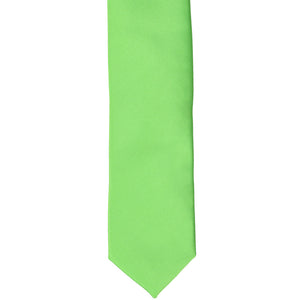 The front of a spring green tie, laid flat
