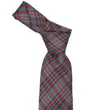 Load image into Gallery viewer, A necktie with a textured plaid pattern in spruce, crimson red, and white, tied in a knot and shown against a plain white background.