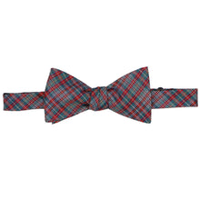 Load image into Gallery viewer, A tied bow tie with a spruce, red and white classic plaid pattern, displayed horizontally against a plain white background.