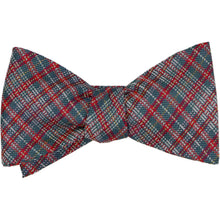 Load image into Gallery viewer, A tied bow tie featuring a classic plaid pattern in spruce, red and white, presented on a clean white background.
