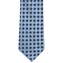 Load image into Gallery viewer, A steel blue necktie with a repeating geometric pattern of navy blue octagons and small white square details, shown flat against a white background.