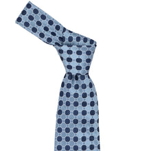 Load image into Gallery viewer, A steel blue necktie with a repeating geometric pattern of navy blue octagons and white connecting lines, styled in a knot on a plain white background.