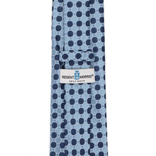 Load image into Gallery viewer, A steel blue necktie with a navy blue geometric pattern, featuring a brand label for 'Regent Morris Neckwear' in the center.