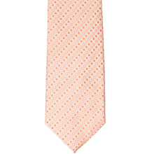 Load image into Gallery viewer, The front of a bright orange tie with a small square pattern