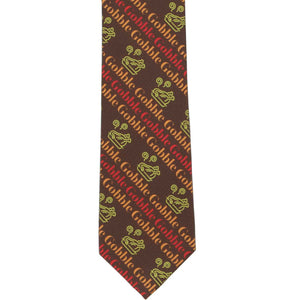 The front of a brown slim tie with a striped Thanksgiving turkey and gobble motif