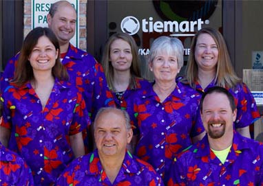 Tiemart family wearing matching Hawaiian shirts