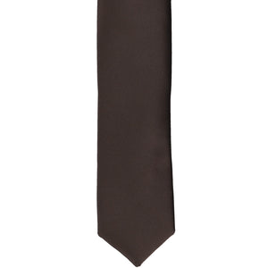 The front of a truffle brown skinny tie, laid flat