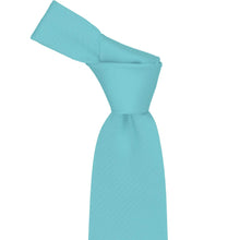 Load image into Gallery viewer, Knot on a turquoise herringbone necktie on a white background
