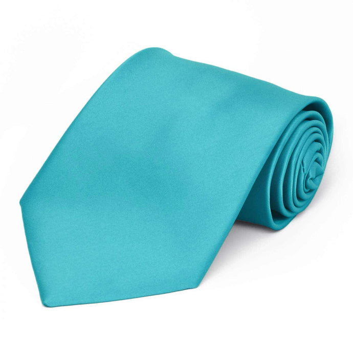 A turquoise premium solid color tie, rolled to show off the front