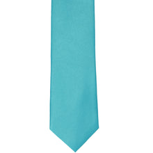 Load image into Gallery viewer, The front of a turquoise slim tie, laid out flat