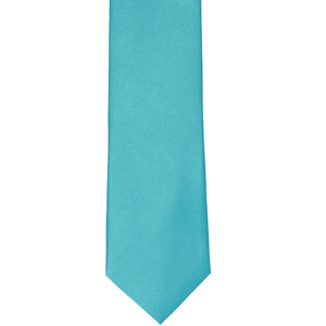 The front of a turquoise slim tie, laid out flat
