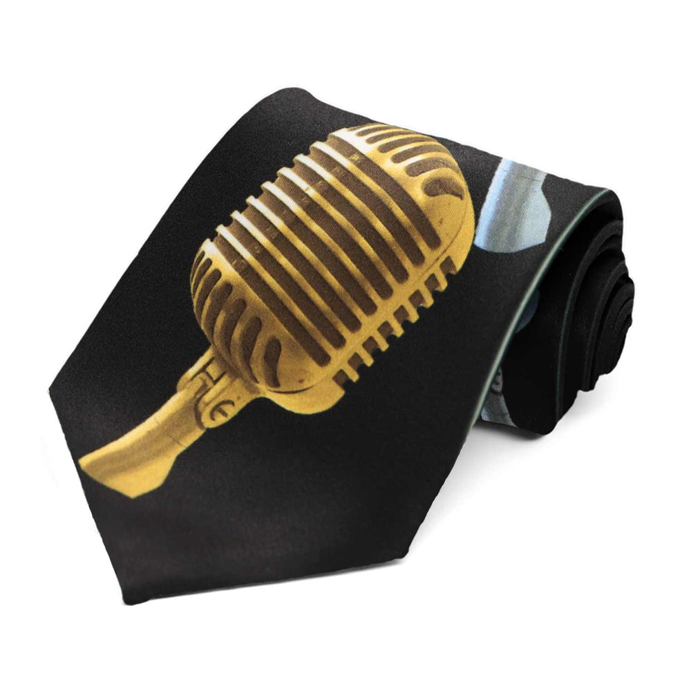 A black tie with a large gold vintage microphone on the front