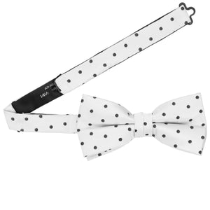 A pre-tied white and black polka dot bow tie with an open band collar