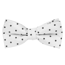 Load image into Gallery viewer, A white pre-tied bow tie with black polka dots
