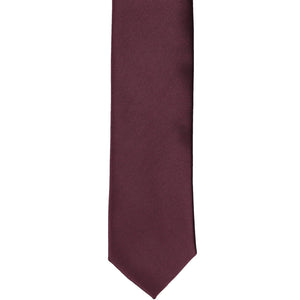 The front of a wine skinny tie, laid flat