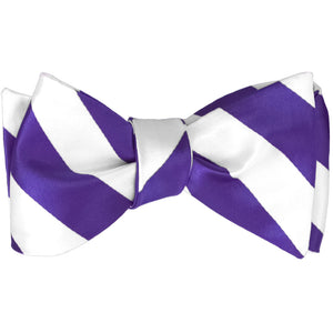 Purple and white striped self-tie bow tie, tied