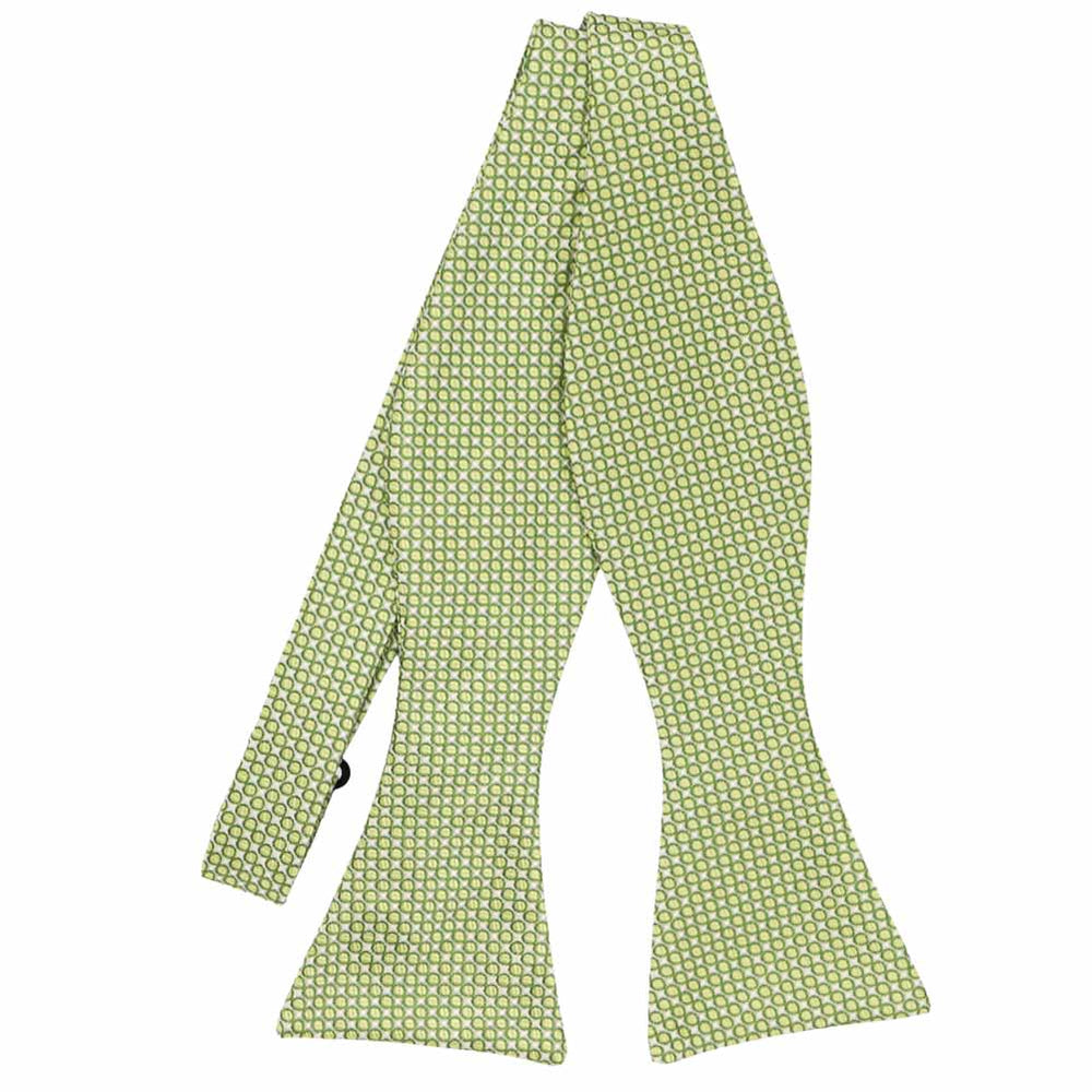 Light green circle pattern self-tie bow tie, untied flat front view