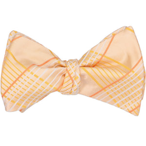 An apricot plaid self-tie bow tie, tied