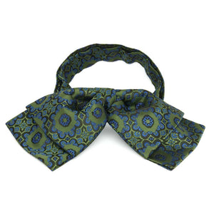 Front view of a green and blue floral pattern floppy bow tie