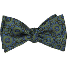Load image into Gallery viewer, An avocado green self-tie bow tie, tied, in an abstract floral pattern