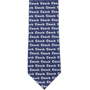 The front of a blue tie with a repeated Coach word pattern