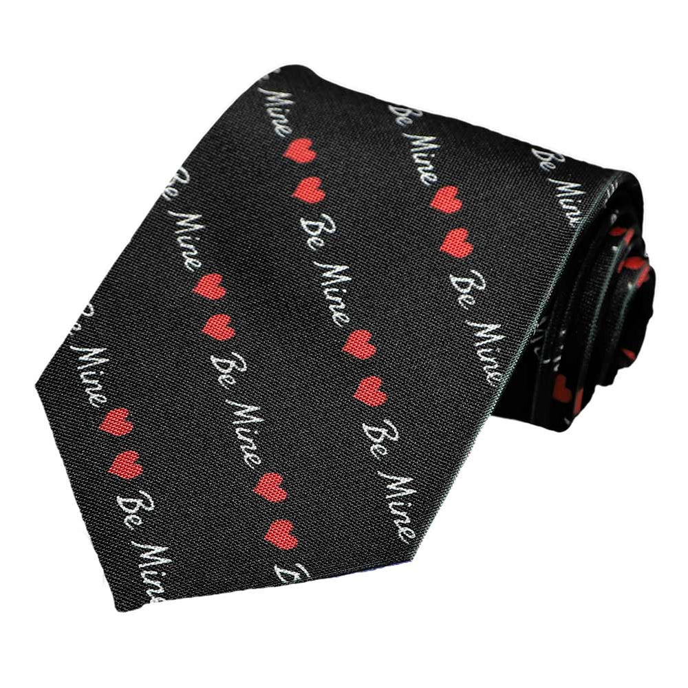 A black extra long tie with a be mine and heart striped pattern