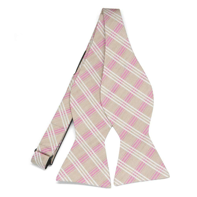 An untied beige pink and white plaid self-tie bow tie