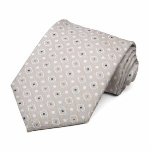 Beige necktie rolled to show the white and tan square geometric pattern