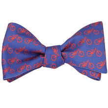 Load image into Gallery viewer, A blue and red bicycle self-tie bow tie, tied