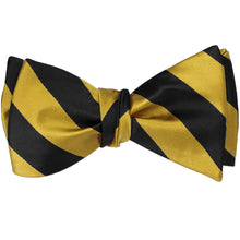 Load image into Gallery viewer, A black and gold striped self-tie bow tie, tied
