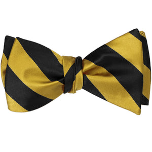 A black and gold striped self-tie bow tie, tied