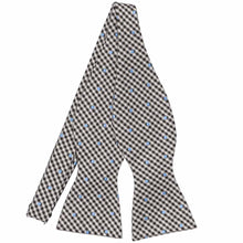 Load image into Gallery viewer, An untied black and off white self-tie bow tie with powder blue polka dots