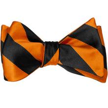 Load image into Gallery viewer, Black and orange striped self-tie bow tie, tied