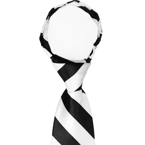 The knot on a men's black and white striped zipper tie