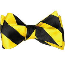 Load image into Gallery viewer, A black and yellow striped self-tie bow tie, tied