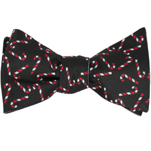 A tied black self-tie bow tie with a candy cane design