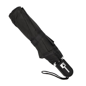 Black compact umbrella out of case