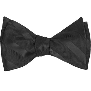 A black tied self-tie bow tie in tone-on-tone stripes