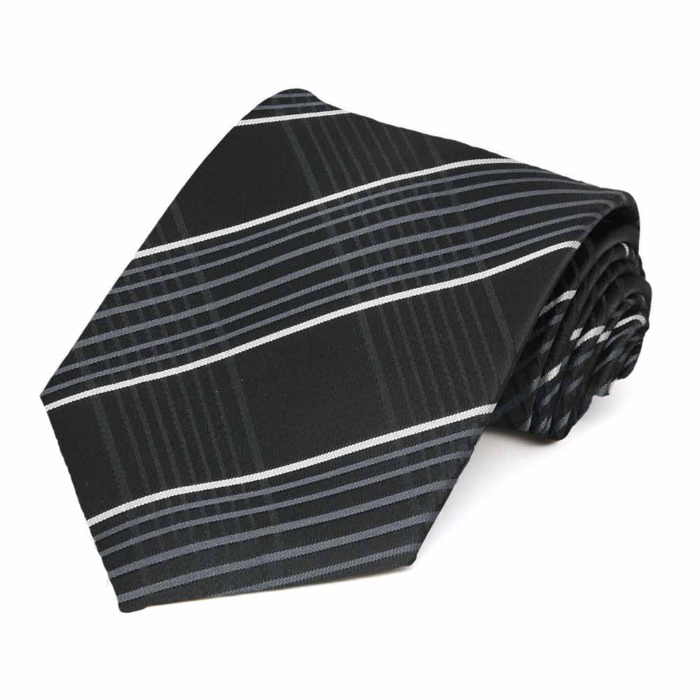 Rolled view of a black, silver and white plaid extra long necktie