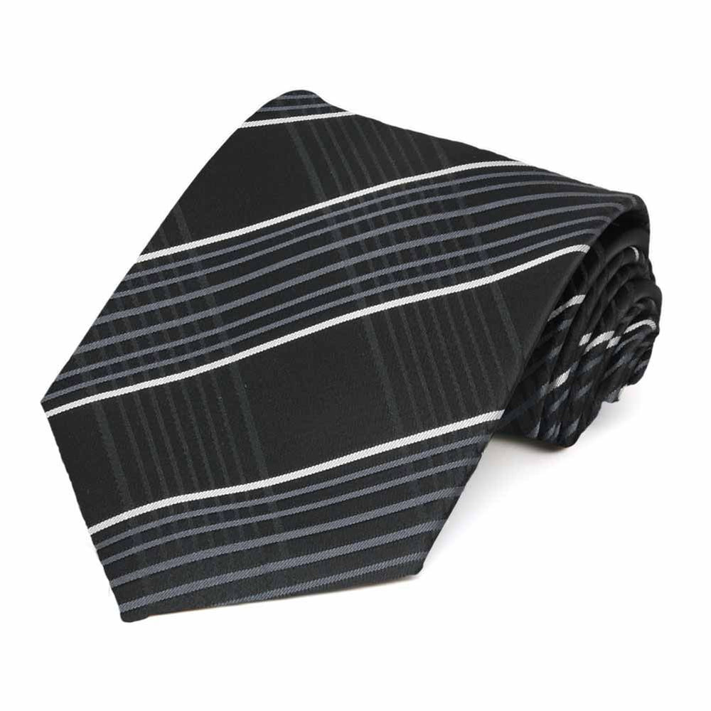 Rolled view of a black, silver and white plaid tie
