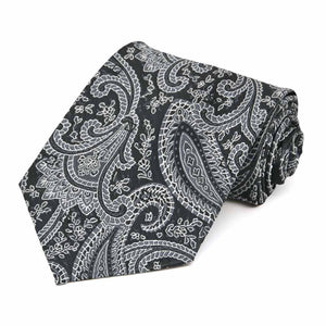 Black and silver paisley tie, rolled to show pattern up close