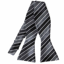 Load image into Gallery viewer, Flat front view of an untied black, gray and white striped self-tie bow tie