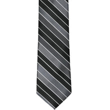 Load image into Gallery viewer, The front of a black striped slim tie