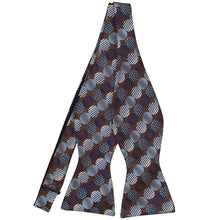 Load image into Gallery viewer, An untied brown self-tie bow tie with large blue dots