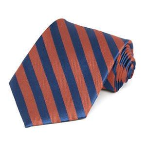 Burnt orange and blue striped necktie rolled to show the texture of the orange stripes