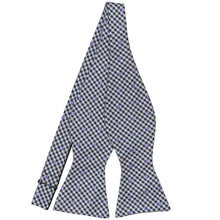 Load image into Gallery viewer, A gingham self-tie bow tie in shades of blue with purple polka dots, untied