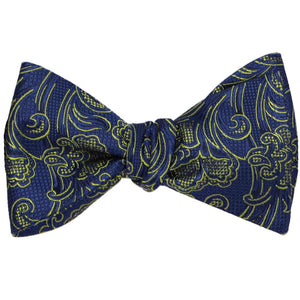 A tied blue and yellow floral bow tie with a textured, checkered pattern