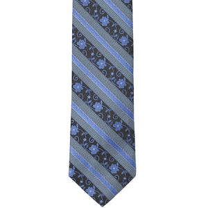The front tip of a blue floral striped tie