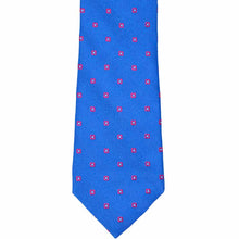 Load image into Gallery viewer, The front of a blue tie with small pink flowers
